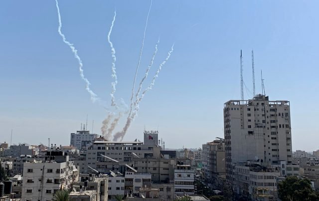 Trails of smoke are seen as rockets are fired from Gaza towards Israel, in Gaza